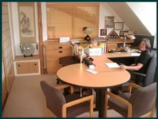 Linda Saunders, CFE, in her Quilcene office in Northwest Washington.
